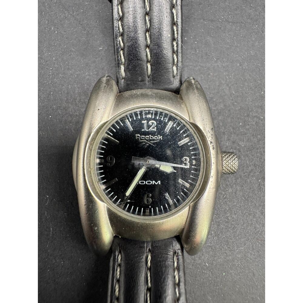 REEBOK Women's 100M Silver Tone Watch Black Leather Band Stainless Steel Back